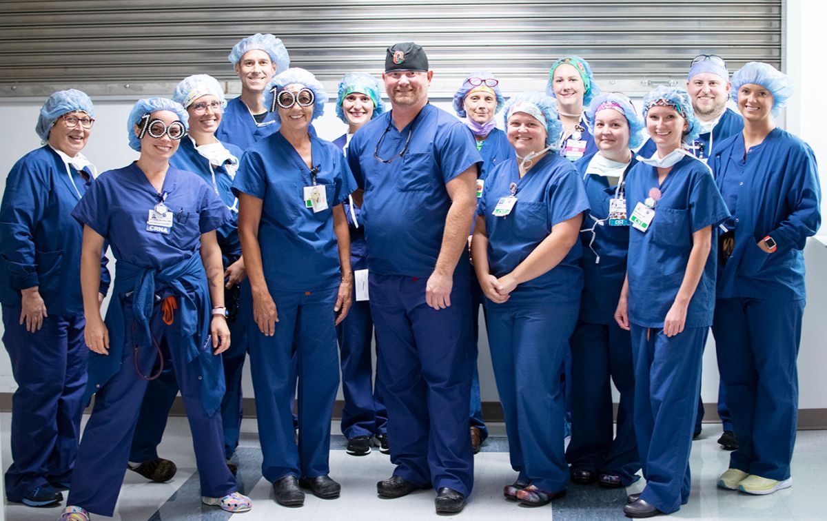 Rutherford Regional Health System Operating Room team members pose for a photo with Dr. Jason Glover, center, following the completion of the 100th Lapiplasty procedure.